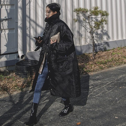 Women's padded longline coat with high stand-up collar and quilted seams 1